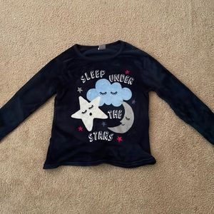 A long sleeve, fur textured pajama shirt